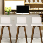 display of white Faux Leather Wood Swivel Bar Stool