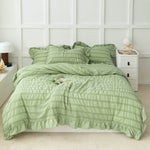 green display of 3-Piece Ruffled Comforter Sets