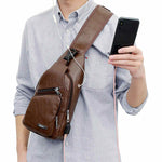 Display of Leather Crossbody Sling Chest Bag w/ USB Charge Port