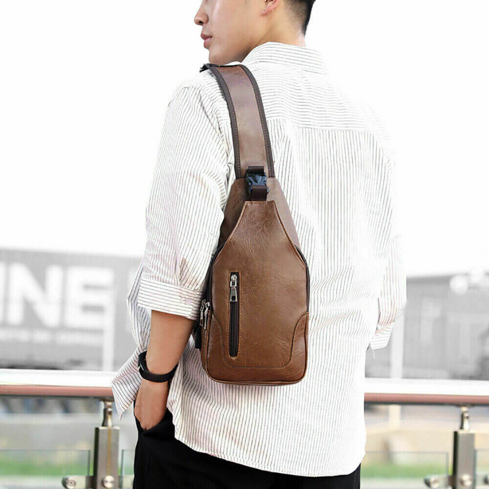 Display of Men PU Leather Chest Sling Bag w/ USB Charging Port